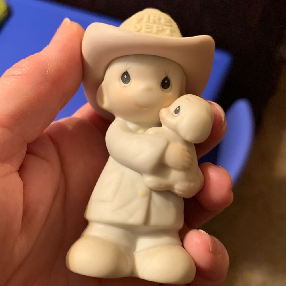 Precious moments fireman ornament.